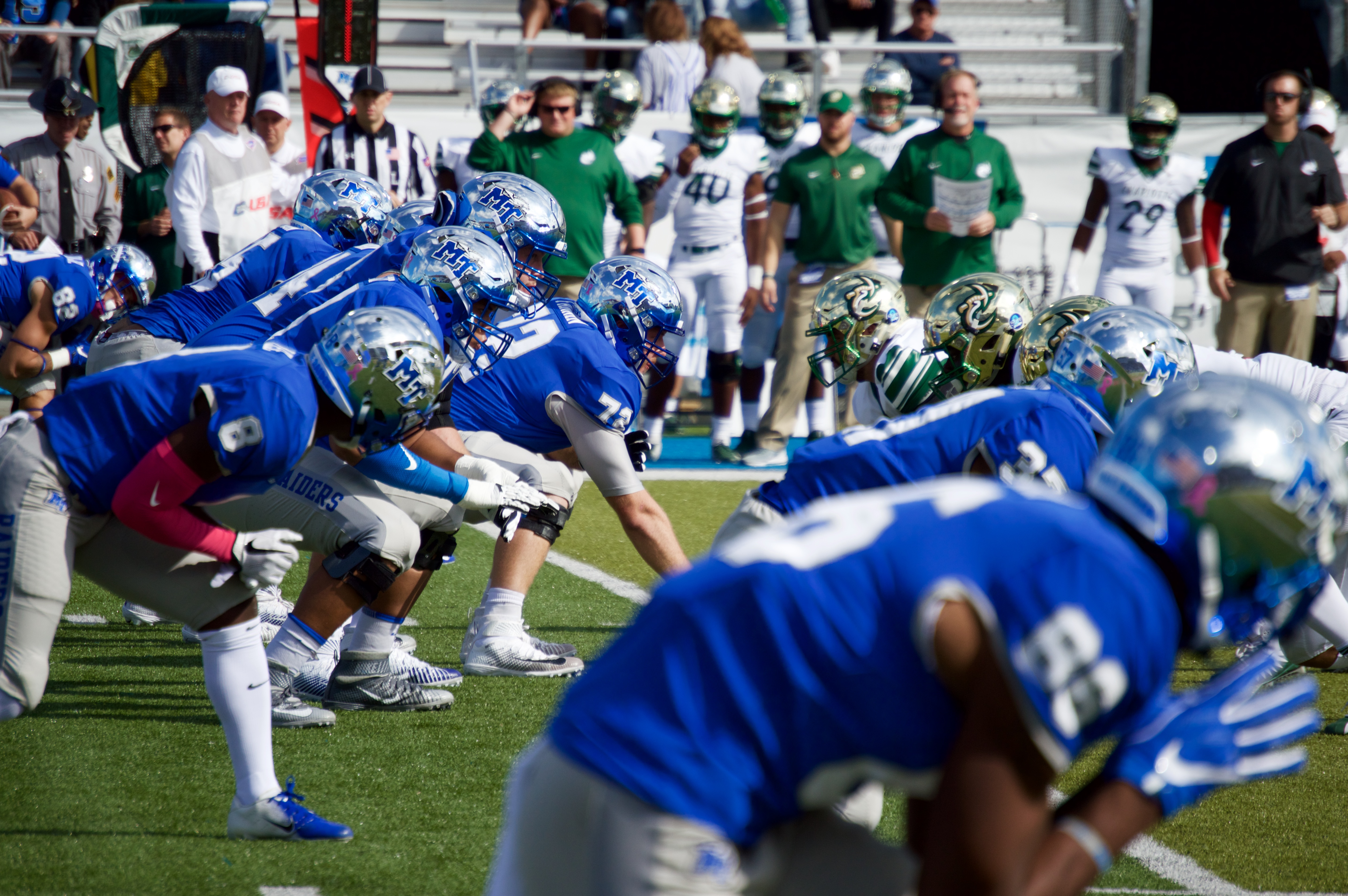 Middle Tennessee State University football players in three-point stance.