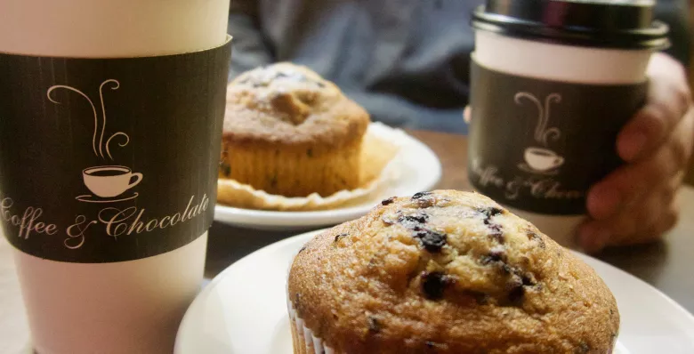 A cup of coffee and chocolate muffin at Coffee &amp; Chocolate in Knoxville