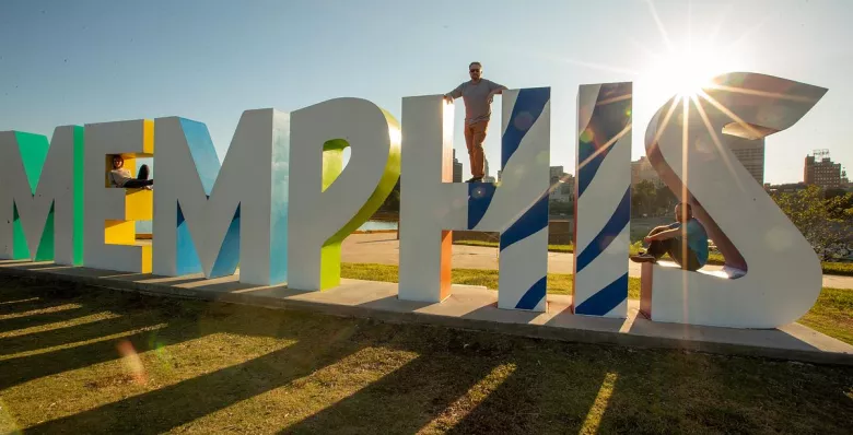 Mud Island MEMPHIS sign in front of the Memphis skyline