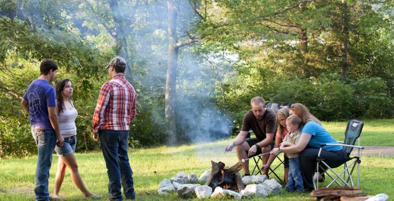 A family around a campfire at Natchez Trace State Park, TN