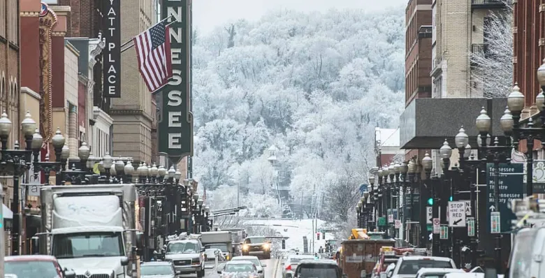 Downtown Knoxville with snow on the trees in the background