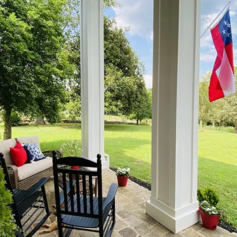 Enjoy a glass of tea or whiskey on the front porch